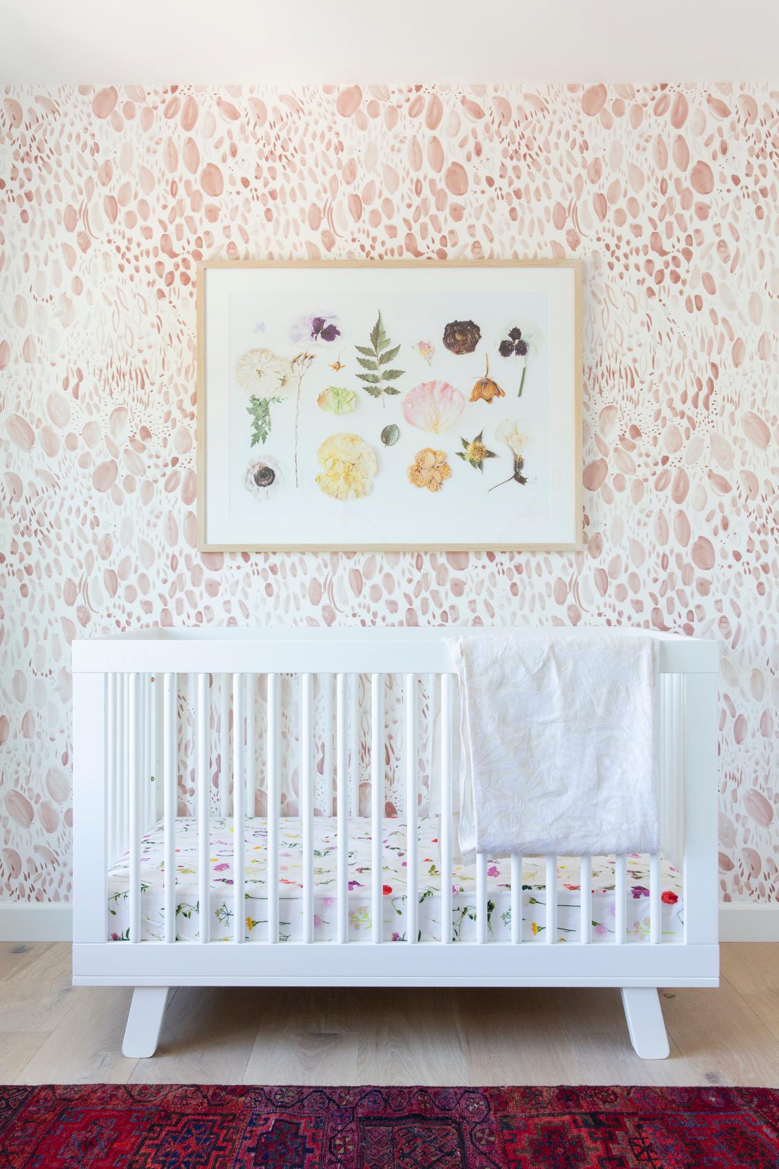 OBSESSED with the Pink Wallpaper in this Baby Girl's Nursery