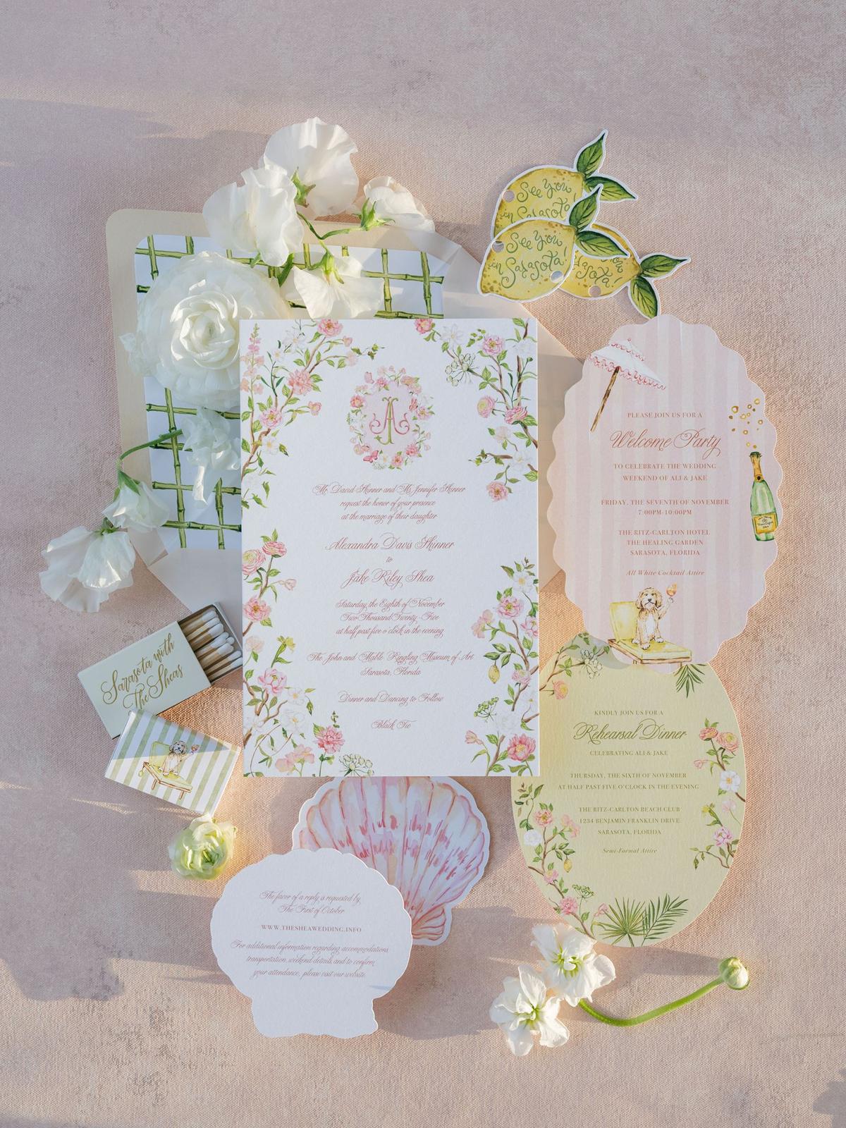 Custom invitation suite with citrus and floral illustrations photographed from above