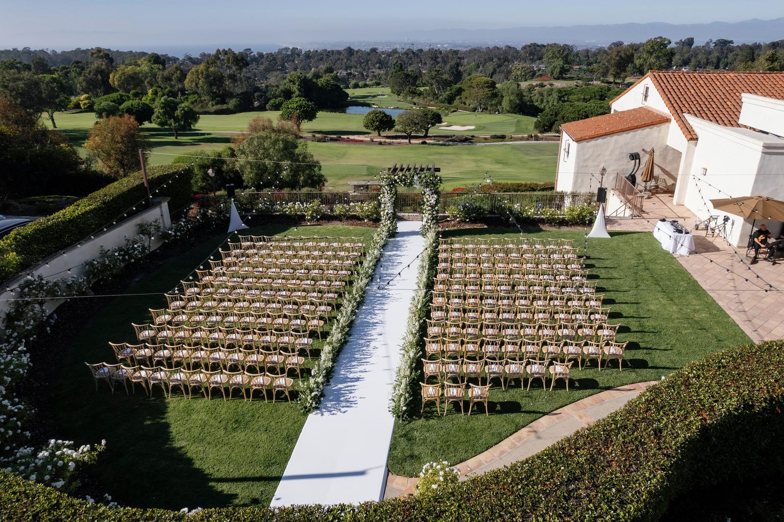Aerial view of a wedding ceremony set up on the lawn at Palos Verdes Golf Club