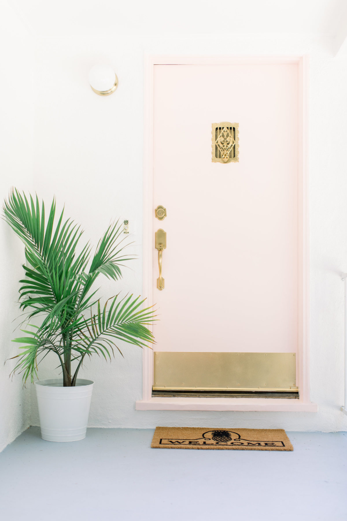 Ring the Pineapple Doorbell on This Blushing Pink Cottage