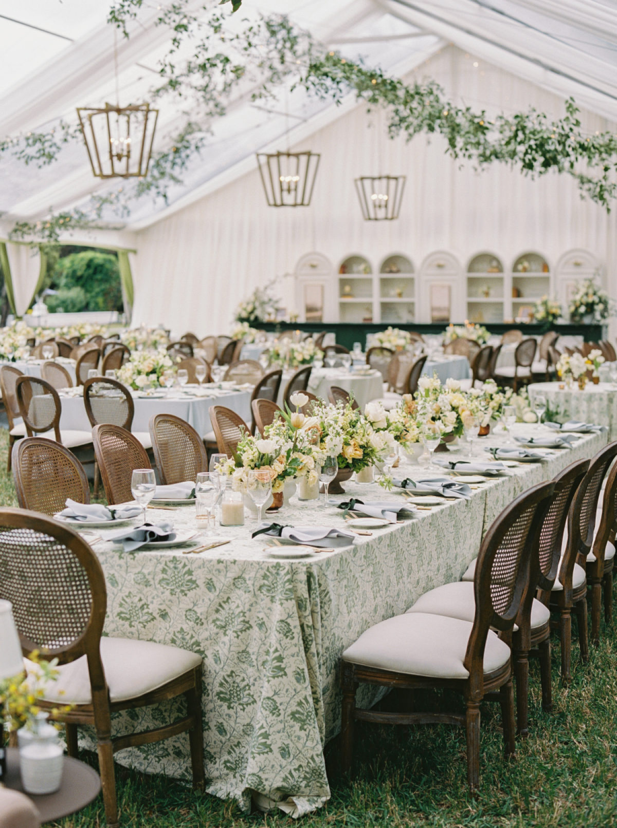 A Jekyll Island Wedding Filled With Dusty Blues, Cane Chairs, and Romantic Garden Details
